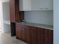 Timber veneer & 2pak bar with underlit onyx benchtops